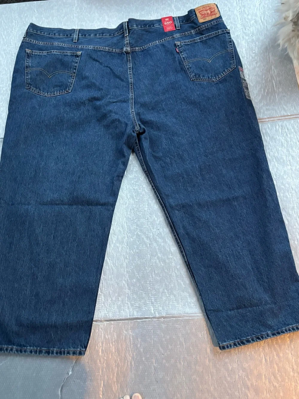NWT Levi's 550’s with a 63W x 30L relaxed fit.